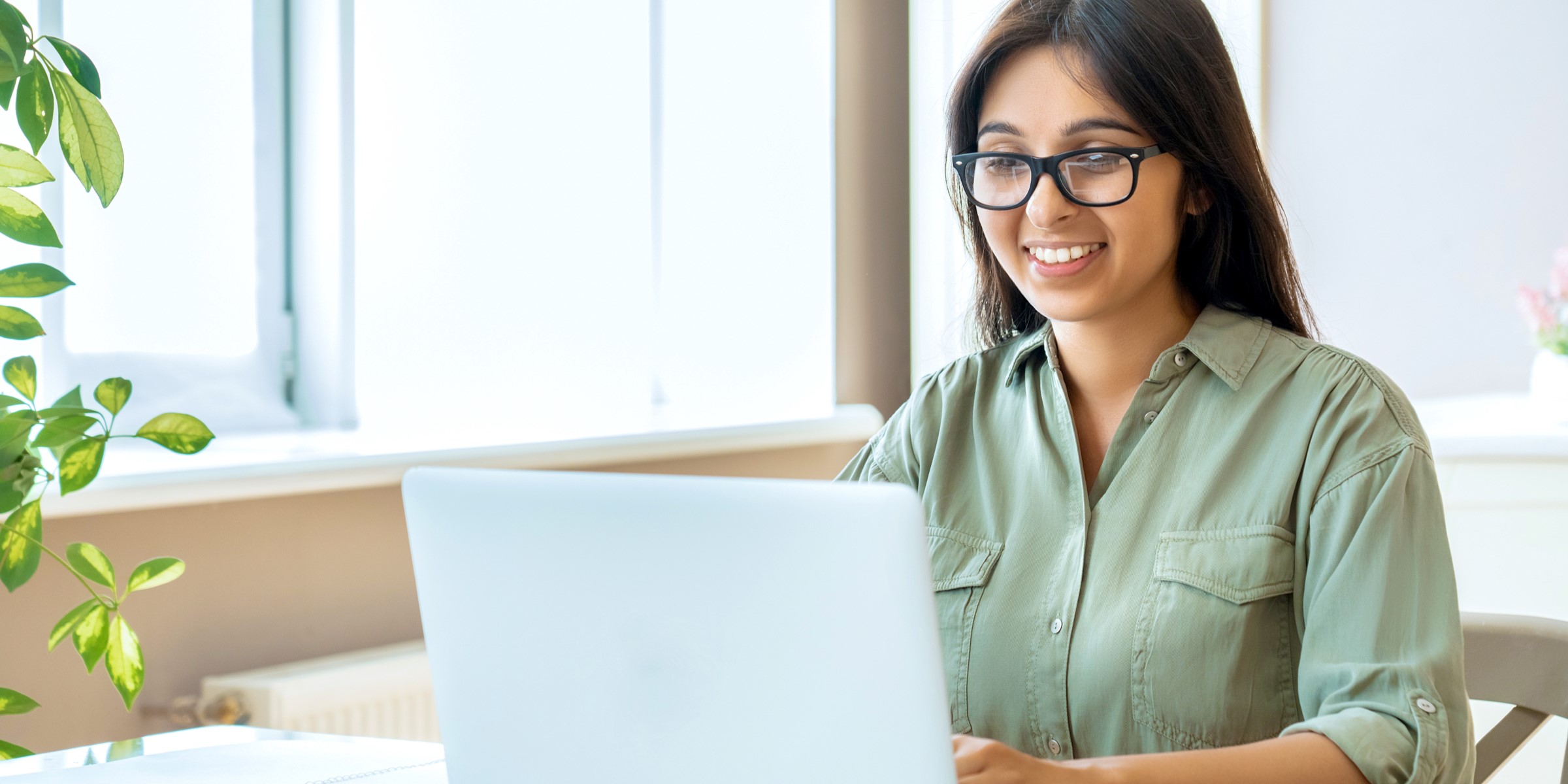 Woman typing on a laptop